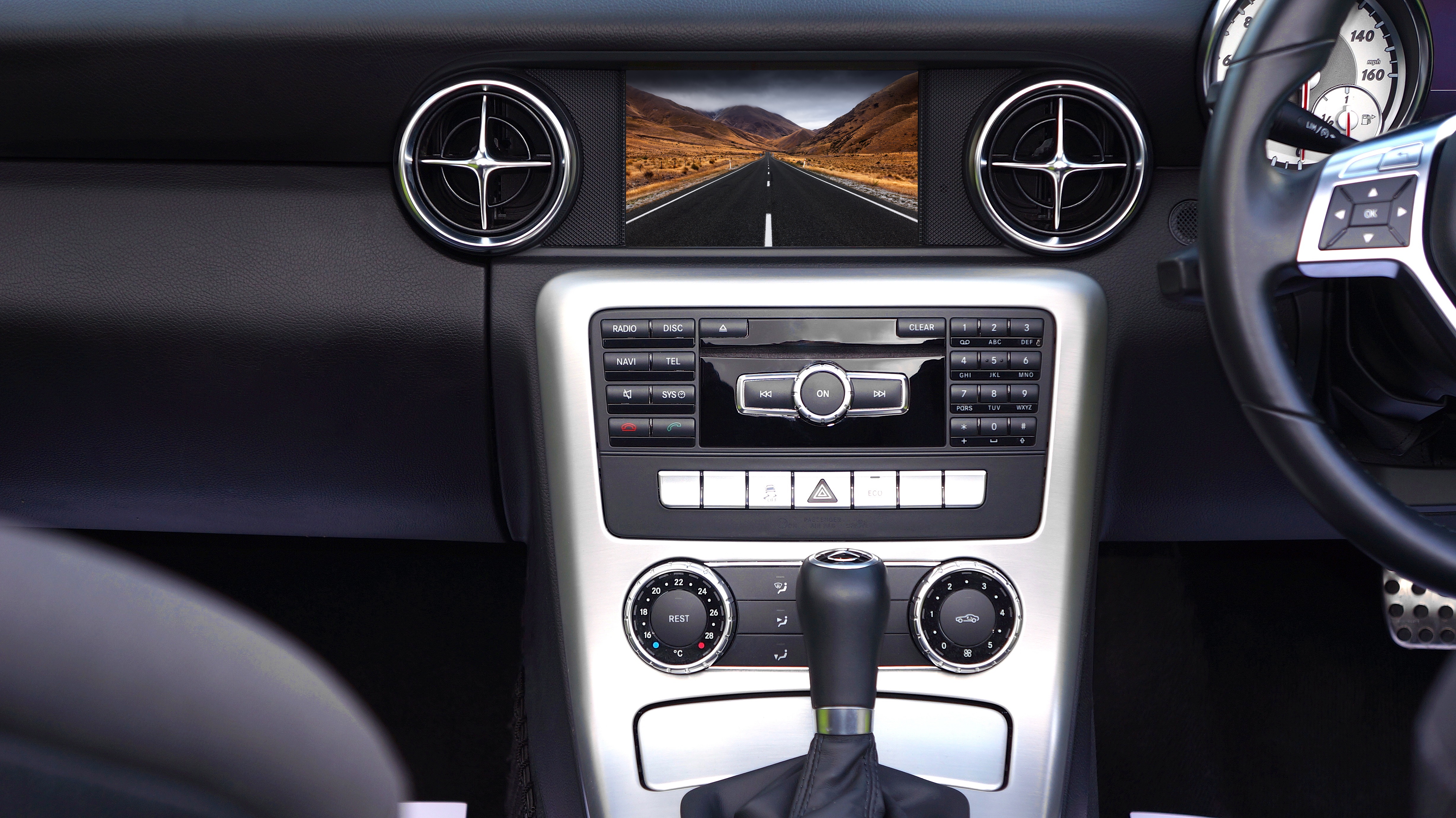 A built-in navigation System showing a map and view of the road in the car  